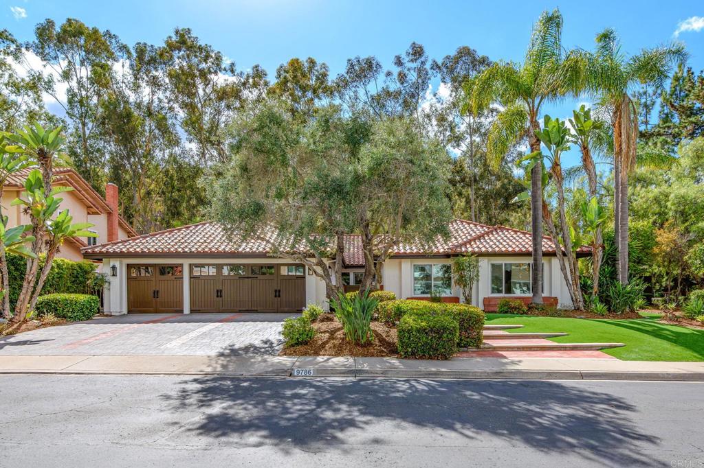 Tucked within the gated enclave of Crown Pointe in Scripps Ranch, this impeccably remodeled single-level residence captures the essence of modern California living — blending contemporary sophistication with relaxed elegance. From its open, light-filled layout to its resort-inspired backyard, every detail has been thoughtfully curated for comfort, privacy, and connection.   A private courtyard entry sets an inviting tone before you step into the home’s vaulted ceilings and wide-plank oak flooring. The open-concept living and dining areas flow seamlessly, creating an effortless sense of space. The living room, centered around a sleek fireplace, invites relaxation and gathering, while the dining area opens through double French doors to the backyard — the perfect setting for al fresco dining.   Beyond an elegant arched entryway, the kitchen reveals itself as a work of art — warm, functional, and beautifully detailed. A 6-burner range framed by a graceful arch and gold pot filler anchors the design, complemented by a white oak island, white shaker cabinetry, quartz countertops, and a farmhouse sink. A charming breakfast nook captures the morning light, creating an inviting spot to start the day.   A separate family room offers a more relaxed gathering space with a custom wet bar, creating the ideal spot for movie nights or hosting guests.   The primary suite is designed as its own private wing — a spacious retreat featuring a fireplace sitting area, direct backyard access, and a spa-inspired ensuite with dual vanities, a double shower with dual shower heads, and a walk-in closet that conceals a hidden bonus room — perfect for a home office, yoga studio, or dressing space.   Three additional rooms and one full bath plus a powder room complete the interior, each space thoughtfully designed with timeless finishes and attention to detail.   Outside, the lushly landscaped backyard feels like a private resort, with multiple access points and private patios throughout the home. Flagstone walkways weave through the space, connecting outdoor areas and adding natural texture, while a rock waterfall and pond create a serene focal point. A thatched palapa lounge provides the perfect setting for dining or relaxing in style amid tropical-inspired greenery.   Within Crown Pointe, residents enjoy gated security, a community pool and spa, tennis courts, and a clubhouse, surrounded by tree-lined streets and a welcoming neighborhood ambiance.   Experience the exceptional design, privacy, and easy elegance of this Scripps Ranch retreat — schedule your private showing today.