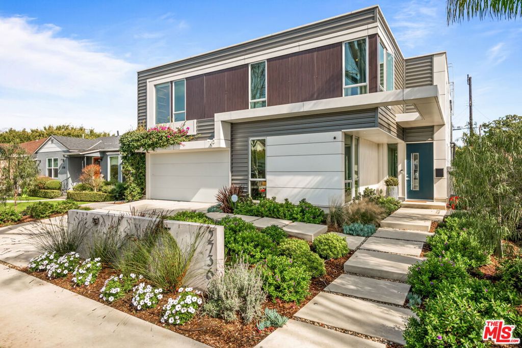 Welcome to 2736 Armacost Avenue, an exquisite 5-bedroom, 3-bathroom residence spanning 3,165 square feet of thoughtfully designed living space. Built in 2017, this modern Mar Vista home blends elevated architectural design with practical functionality. The open floor plan connects the living, dining, and kitchen areas to the ground-level outdoor spaces, creating a seamless indoor-outdoor flow ideal for both entertaining and everyday living. The gourmet kitchen features top-of-the-line appliances, sleek cabinetry, and a spacious island perfect for casual meals or formal gatherings. One bedroom is conveniently located on the first floor, offering flexibility for guests, a home office, or multigenerational living. Upstairs, the expansive primary suite serves as a peaceful retreat with a hidden walk-in closet and a spa-like en-suite bath featuring dual vanities, a soaking tub, and a separate glass-enclosed shower. Three additional bedrooms upstairs provide versatile options for guests, family, or additional work-from-home setups. The beautifully landscaped backyard, complete with a built-in BBQ, offers a private oasis for al fresco dining or quiet relaxation in the California sun. A finished two-car garage and an additional two-car driveway complete the property. Available furnished or unfurnished, this exceptional home is located just moments from Mar Vista's popular shops, amenities, and dining destinations.