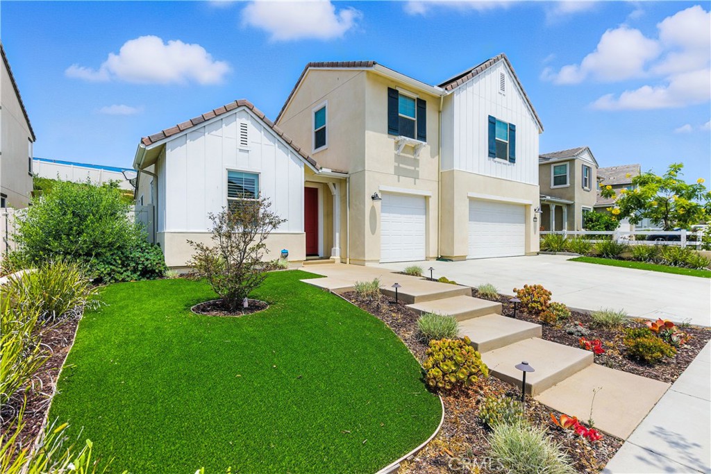 Modern 2020-built 4BR/2.5BA home in the highly sought-after SL Rey community of Bonsall. Located on a quiet street near top-rated schools and the future Bonsall Community Park, this spacious home offers both comfort and convenience. Light-filled open floor plan with tall ceilings, luxury hard flooring on the main level, and plantation shutterst. The spacious kitchen features quartz countertops, premium stainless appliances, and a large island, opening to the family room and oversized sliding doors leading to a large private backyard - perfect layout for a potential swimming pool and entertainment bar build out, with a block privacy wall.
The first-floor primary suite offers comfort and convenience. A lower-level office can be easily converted into a 5th bedroom. Upstairs includes secondary bedrooms and a second laundry area (additional laundry in garage). Energy-efficient upgrades include fully paid solar, dual-zone A/C and heat, whole-house fans, tankless water heater, and a newer security system. Plenty of space to live, work, and entertain in one of North County’s most peaceful settings.