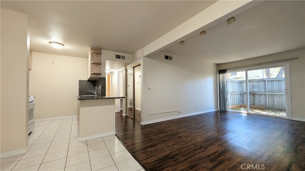 A beautifully maintained 2-bedroom, 2-bathroom condo in the heart of Tarzana. This inviting home offers 910 square feet of comfortable living space with a bright and open layout. The open concept living area includes wood laminate and tile flooring throughout, and the family room opens to a large balcony. The complex provides well-maintained community laundry rooms for your convenience. The unit features central heating, air conditioning, and a private covered patio. Parc Tarzana offers excellent amenities, such as a community pool, and recreation room. The complex is quiet, clean, and well-maintained. This condo is ideal for individuals wanting to be close to dining, shopping, and public transportation.