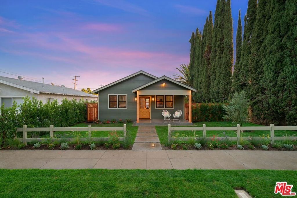 Tucked just above York Blvd in the creative heartbeat of Highland Park, 5252 Range View is a reimagined 1923 gem, rebuilt with intention, elevated with designer style, and restored with a deep respect for its historic soul. This is not just a renovation. It's a revival. From the moment you enter, the home opens up beneath soaring vaulted ceilings, with sunlight pouring in to highlight the warm tones of the wood floors. The main living spaces flow effortlessly, designed for gathering, unwinding, and living beautifully. The kitchen is the centerpiece: crisp quartz countertops, custom cabinetry, high-end stainless steel appliances, and a dramatic waterfall island where morning coffee and evening conversations feel equally at home. The adjacent dining area invites long dinners and shared moments, while the family room extends through French doors to an enchanting enclosed side patio, your private outdoor lounge wrapped in greenery. Here, a raised deck creates a dreamy setting for candlelit meals or lazy afternoon lounging, surrounded by colorful gardens that attract hummingbirds, butterflies, and soft natural soundscapes from dawn to dusk. A thoughtful office nook offers a quiet place to work or create, while the three bedrooms are serene retreats, each offering calm and comfort. The primary suite offers a true sense of escape, where French doors open to a spacious rear deck and serene outdoor views. The en-suite bathroom, softly lit by a skylight, showcases dual vanities, a sleek walk-in shower, and high-end designer finishes that evoke the ambiance of a boutique hideaway.Step outside and discover a series of inviting outdoor areas: vibrant front gardens, a private side patio and generous yard, perfect for children and gatherings, and a glowing back deck for lounging under the sun. Native plants and soft textures tie it all together in a calm, natural flow.The newly constructed detached garage is equally versatile, ready to become a creative studio, home gym, office, or future ADU (buyer to verify). And with a new HVAC system and new roof, the home brings peace of mind to match its beauty. All of this sits in one of Highland Park's most coveted pockets, where you can stroll to Cafe De Leche for a morning latte, share dinner at Amiga Amore, pick up sweets at Kumquat, settle into Collage Coffee with your laptop, or catch a show at the Bob Baker Marionette Theatre. Figueroa's restaurants, boutiques, nightlife, and the natural trails of the Arroyo Seco are only minutes away. A poetic blend of heritage, design, and Eastside energy. This home is both a private retreat and a launchpad into one of L.A.'s most vibrant cultural neighborhoods.