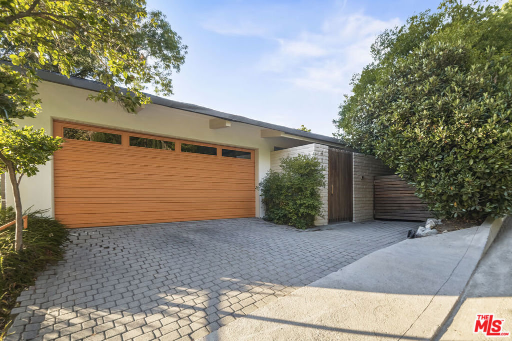 Furnished Mid-Century Modern with Views & Pool Short-Term Lease. Stylish 3BD, 2.5BA home offered fully furnished for a short-term lease. Enjoy panoramic city and mountain views, an expansive living/great room, hardwood floors, and double sliders to a large patio. Third bedroom doubles as an office with a fold-out king bed. Secluded backyard with pool, multiple decks for entertaining, and a converted garage gym. Property available from Sept 1, 2025 to Dec 31, 2025 only.