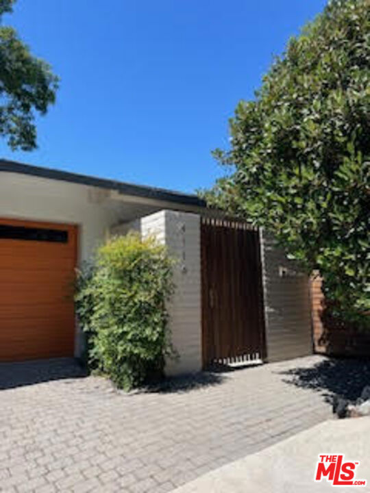 Furnished Mid-Century Modern with Views & Pool Short-Term Lease. Stylish 3BD, 2.5BA home offered fully furnished for a short-term lease. Enjoy panoramic city and mountain views, an expansive living/great room, hardwood floors, and double sliders to a large patio. Third bedroom doubles as an office with a fold-out king bed. Secluded backyard with pool, multiple decks for entertaining, and a converted garage gym. Property available from Sept 1, 2025 to Dec 31, 2025 only.