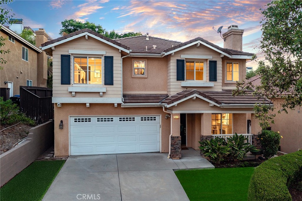 Completely remodeled home originally built in 2002 located South of the Boulevard at the end of a cul-de-sac. Elevated above the street, the front yard features driveway that leads to the 2-car garage and a wide covered front porch. Step inside to find a completely open floor plan with designer finishes and custom details. The formal living room features a wood mantled fireplace, large picture window overlooking the front yard, and wide plank wood floors found throughout. A separate formal dining room has two-story soaring ceilings with direct kitchen access. The chef’s gourmet kitchen boasts center island with breakfast bar seating, quartz counters with custom soft close cabinetry, stainless appliances, pantry space with pullout drawers, and breakfast nook with built-in bench seating. The kitchen opens directly to the separate spacious family room with French doors that open to the backyard. The first floor also features a downstairs bedroom ideal for guests or office space with access to a remodeled hall bathroom with walk-in shower. A separate laundry room has built-in storage cabinetry and access to the 2-car finished garage with overhead storage racks. Upstairs you will find three additional bedrooms plus an oversized loft/work space with built-in desks and storage - perfect flex space for play room/gym/etc. The luxurious primary suite is located on a private wing boasting double door entry, high vaulted ceiling, walk-in closet with second additional wardrobe closet, and en-suite remodeled bathroom with custom vanity with dual sinks, quartz counter, built-in linen storage, soaking tub, seamless walk-in shower, and separate toilet room. The two well appointed secondary bedrooms each have closets with built-ins and they share a remodeled hall bathroom with custom vanity, dual sinks, bath tub, and shower. The private backyard features large patio with overhead string lights perfect for entertaining and dining alfresco, built-in gas fire pit, & lush landscaping with mature trees that provide wonderful shade. Adjacent to dining & shopping at the Calabasas Commons, nearby markets including Bristol Farms & Trader Joes, close proximity to the Westfield Mall/Village & Warner Center, and zoned for highly acclaimed Calabash elementary, Hale and El Camino charter schools.