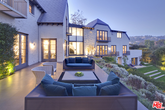 The crown jewel of one of Beverly Hills' finest streets. Designed with only the most elite level of craftsmanship, this recently renovated home seamlessly blends historic elegance with contemporary sophistication. Expansive public rooms lead to large terraces that overlook the Marmol Radziner designed grounds and rolling hills beyond. Enjoy the ultimate privacy behind walls and gates. 5 bedroom suites, 8 bathrooms. Features include floating sculptural staircase, gourmet kitchen, screening room, lavish wine cellar, fitness center, detached guest house. Approximately 38,000 square feet. Close proximity to Beverly Hills Hotel and world-famous, Rodeo Drive. This rare offering is shown to pre-qualified clients only.
