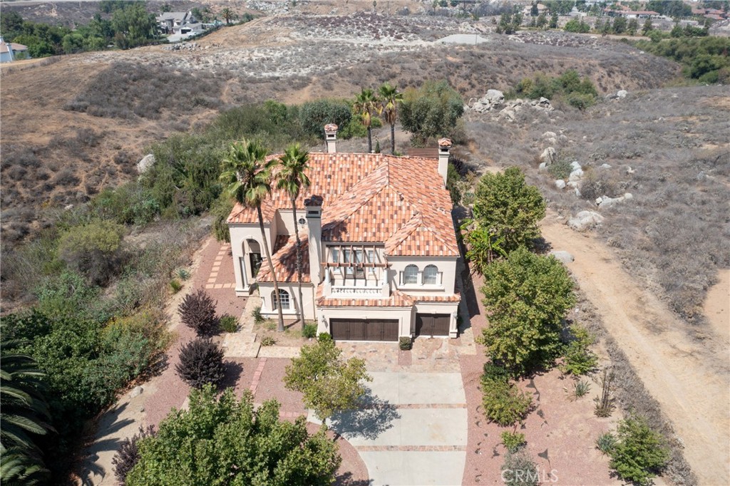 Welcome to the luxury Hillcreast Estates community! This is a beautiful, Meditterranean architutual design with 4 bedroom and 51/2 bathrooms. Entryway is tile flooring with spiral staircase to second level. Main level floor features one bedroom and 1 and 1/2 baths, formal living room with fireplace. Formal dining room features a fireplace and wet bar. Large kitchen with double ovens, double microwaves, granite countertops that connect with the living room. Large windows overlook the swimming pool and hills. Upstairs features loft with a wet bar, large balcony and 2 bedrooms each with full baths. Master bedroom includes large open floor plan with fireplace, jaczzi tub, wet bar, double sinks, private sauna and large balcony. Long private driveway with electronic security gate and 3 car garage. The backyard features private swimming pool, jacuzzi, fireplace and barbecue island. This home also comes with security camera's both inside and out. Very private and quiet neighborhood that is close to shopping centers.