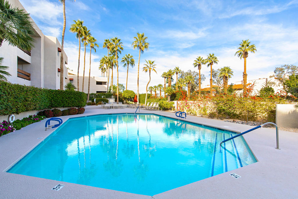Welcome to this condo in a complex with architectural significance designed by Hugh M. Kaptur in the heart of Palm Springs! This ground-floor unit is perfectly situated near downtown, offering easy access to the city's best shopping, dining, and entertainment. Featuring an expansive private patio, this home is paradise, ideal for relaxing with morning coffee or hosting sunset gatherings under the desert sky. Inside, you'll find a bright and airy open floor plan with sleek accents. The living area flows seamlessly into the dining space and kitchen. Sliding glass doors provides direct access to the patio and a full-sized washer and dryer closet with some storage, creating a harmonious indoor-outdoor living experience with mountain view. The spacious bedrooms offer a serene retreat with ample closet space. Additional highlights include tile flooring throughout, and energy-efficient features like dual paned windows and newer HVAC and hot water heater. Boutique complex offers lush landscaping, a sparkling community pool and spa, and covered parking that is located close to the unit. Don't miss this rare opportunity to own a centrally located condo that combines modern luxury with Palm Springs' iconic lifestyle! HOA dues: $577/month and include Earthquake Insurance, water, sewer, trash.