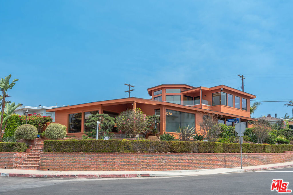 Perched on a coveted hilltop in Playa del Rey, this beautifully updated 3-bedroom, 3-bathroom contemporary residence situated on a sprawling 6,153 sqft. lot offers sweeping, unobstructed ocean views from nearly every room. Floor-to-ceiling windows, vaulted ceilings, and custom skylights flood the home with natural light, creating a warm, airy ambiance throughout. The open-concept living space features wood and tile flooring, recessed lighting, and a seamless flow to the ultra-private backyard oasis complete with a spa, perfect for relaxing or entertaining. The chef's kitchen boasts custom cabinetry, stainless steel appliances, a breakfast bar, and sleek modern finishes. Upstairs, showcases the spacious primary suite and opens to the wraparound deck with breathtaking sunset and ocean views. An attached two-car garage offers additional storage and a laundry for convenience. A rare opportunity to own a private coastal retreat just two blocks from the beach and close to all Playa del Rey has to offer.