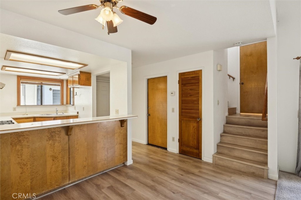 Great opportunity to own a 2-bedroom, 1.5-bath condo in a well-maintained community in South Atascadero, located about 15 to 20 minutes from San Luis Obispo and Paso Robles. The condo’s interior offers vaulted ceilings in the main living area, laminate wood flooring, and a wood-burning fireplace. The bathrooms have both been updated with new vanities, sinks, and faucets. In the kitchen, there is ample cabinet space, a stove, and dishwasher to make living easy. The patio off the main living area expands the usable outdoor space. The attached single car garage offers washer and dryer hookups and includes a quiet, efficient garage door opener with remote access. The community features a pool shared by only 30 units, a clubhouse for gatherings, a basketball/tennis court with an adjustable hoop, and a green grass dog run. In 2024, the complex received significant updates, including new roofs, exterior paint, and a fully resurfaced asphalt driveway. It was also recently tented for termites. Landscaped grounds with mature trees create a pleasant residential environment. The HOA covers front yard irrigation and maintenance, and security cameras are installed throughout the community. A bus stop is conveniently located just outside the entrance for commuters, with northbound service across the street. Suitable for first-time buyers, those looking to downsize, or investors seeking rental income, this property offers the perfect balance of comfort, location and potential.