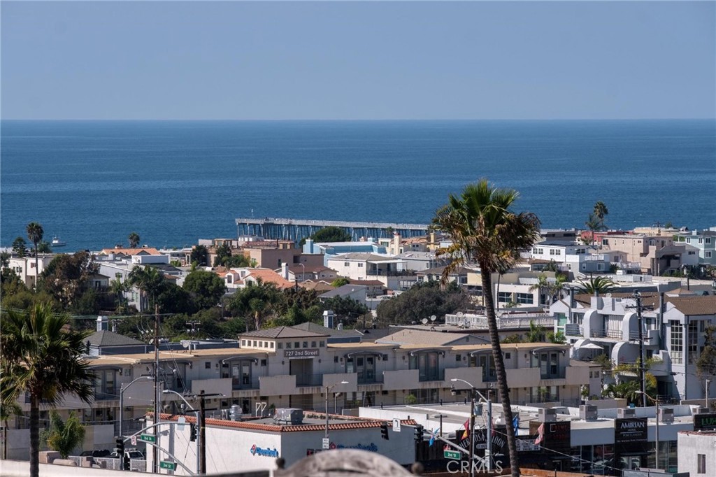 The lowest price per sq ft in South Redondo!! Amazing Value with Ocean Views! This spacious, elegant 4-bedroom, 4-bath custom townhome (2 on a lot) is a few blocks to Hermosa and Redondo beaches and close to award-winning schools.
Enter through grand wrought-iron doors to wood floors and a sweeping staircase. The lower level features a private bedroom with en suite bath, walk-in closet, and direct garage access.
Upstairs, the primary suite boasts a fireplace, oversized walk-in closet, and spa-like bath. Two additional bedrooms share a Jack & Jill bath, each with walk-in closets.
The top main living level showcases soaring ceilings, a light-filled living room with fireplace, built-in cabinet, double pane windows, a deck, large formal dining, and a gourmet kitchen with stainless steel appliances. There's also a guest bath, a separate laundry room and access to the roof top deck where you'll enjoy sweeping ocean views and sunsets! Close to top restaurants, shopping, biking and water activities. Nearby Plant is inactive, No HOA fee.