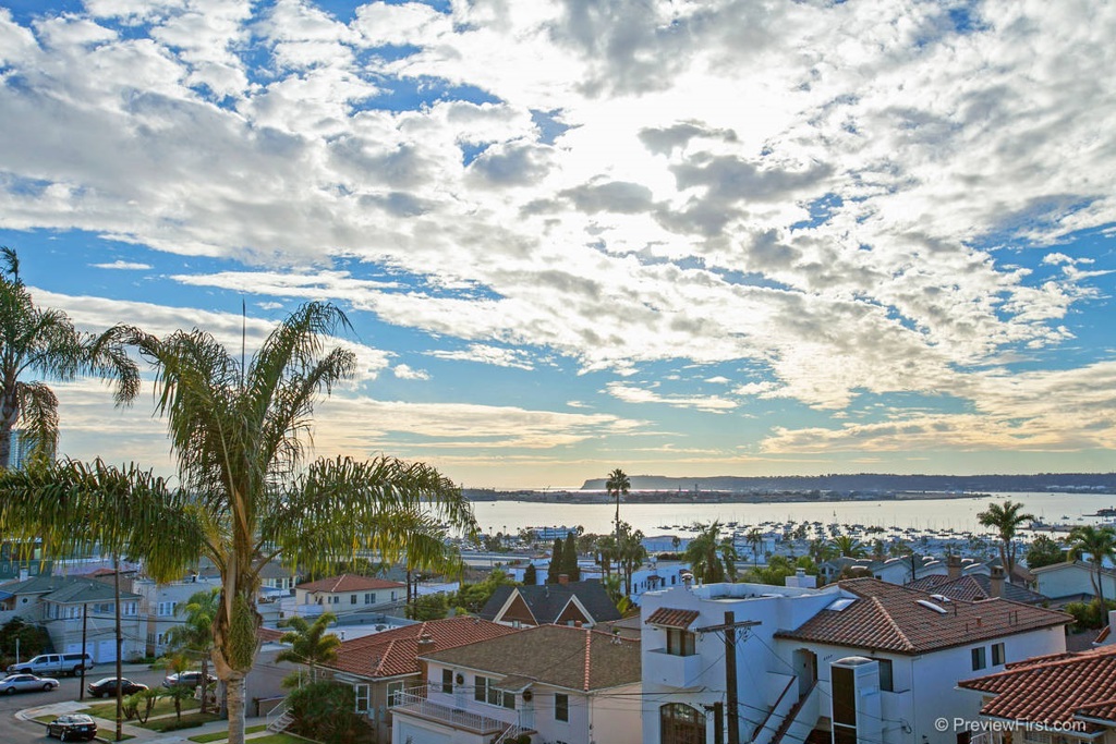 OUTRAGEOUS BAY and CITY VIEWS from this large corner 2 Bed/2 Bath unit with full size washer/dryer. Large open Living Room, featuring a fireplace. A Recently remodeled kitchen w/ granite countertops, fridge, stove/oven, microwave and dishwasher. 2 Gated-secure, underground parking spaces. Water, Gas, and Trash included. Location is IDEAL, walking distance to Balboa Park and tons of fabulous restaurants/shops! Quick and Easy Freeway access. You'll love Bankers Hill! Neighborhoods: Banker's Hill