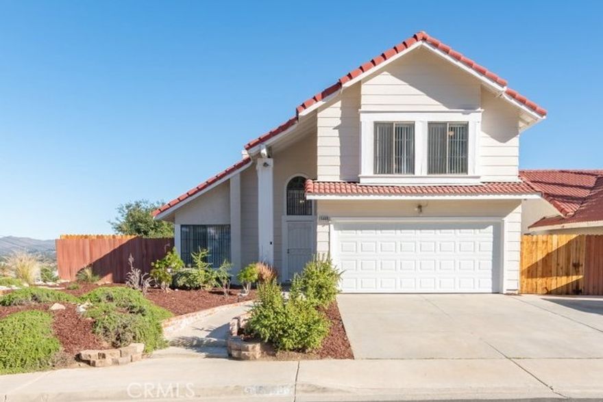 ABSOLUTELY BREATHTAKING VIEWS from this updated and remodeled home. Unobstructed Panoramic views of lake and mountains- very serene and private backyard situated on a corner lot. Home has 3 bedrooms (all upstairs), 3 bathrooms and just under 1,400 sq ft of living space.  The home has been updated and remodeled, inside and out. Kitchen has been remodeled with slate gray cabinets and Quartz countertops, pantry area, new brushed nickel faucet and sink, and new stainless steel appliances. Living room at the front of the home is a great space for relaxing or entertaining. Family room with brick mantle fireplace, wood or gas, opens to the dining room and kitchen. Attached two car garage allows for direct kitchen access.Upstairs you will find the primary bedroom suite is spacious with a sliding glass door that leads to a massive deck.  Enjoy the gorgeous lake and moutain views from your private area.  You will also find an ensuite bathroom with dual sinks, and tub/ shower combo, and large walk in closet. 2 additional spacious bedrooms, and bathroom with tub/ shower combo complete the second story. A few of the new upgrades include: new light fixtures, plumbing fixtures, new shower/ tub inserts, freshly painted inside and out, ceiling fans throughout, window coverings, new luxury vinyl flooring throughout with new carpet in the bedrooms. Large backyard with multiple areas to sit and enjoy the lake and mountain views while entertaining or relxing underneath the large covered patio cover. Low taxes and NO HOA. Great location- close to shopping, schools, and parks.  Convienent access to Ortega Hwy for easy communte to OC or San Diego and 15 freeway if you are traveling to San Diego or LA.  Come check out this darling home- completely remodeled-- ready for you to move right in.