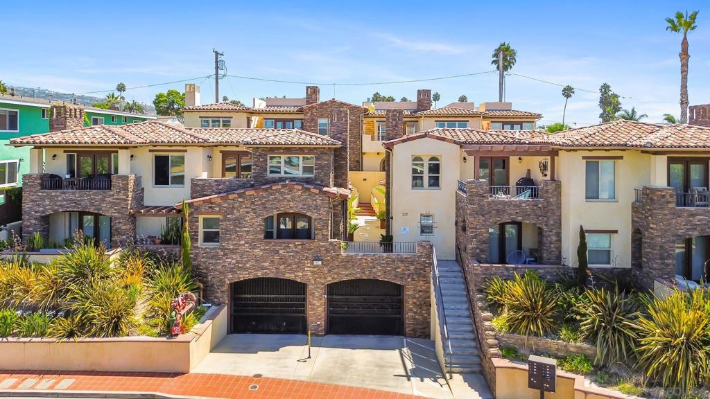 Elevate your everyday in this exceptional Spanish-style townhouse perched above San Clemente’s coastline. With sweeping ocean, city, and harbor views from nearly every room—including a private rooftop deck—this spacious three-bedroom, four-bath home offers the perfect blend of luxury and comfort. The open-concept floorplan showcases vaulted ceilings, rich hardwood floors, and a chef’s kitchen complete with granite countertops, a large center island, Viking range, and premium appliances. Retreat to one of two primary suites, each opening to a balcony with ocean breezes and featuring spa-inspired baths with soaking tubs and custom closets. The third bedroom downstairs provides privacy and its own patio. Enjoy the convenience of secure underground parking, private elevator access, in-unit laundry, and central air. Whether entertaining on the rooftop, relaxing in sunlit living spaces, or strolling just minutes to the beach and vibrant downtown, this turnkey townhome delivers coastal living at its finest. Discover your new sanctuary in one of Orange County’s most coveted neighborhoods.