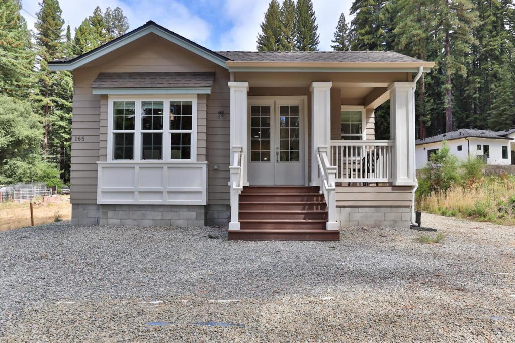 Nestled in the serene Santa Cruz Mountains, turnkey retreat of 2 HOMES each with their own entry & address on a FLAT 1.42-acre lot. Amazing property surrounded by redwoods, oaks, lush forest located on a bright sunshine spot. Main house is new manufactured home on a permanent foundation, **3BR/2.5BA, 1,515 sqft**. Featuring two master suites with recessed ceilings, a gas fireplace, & updated kitchen w/sleek gas range/oven, dishwasher, garbage disposal, pull-out shelving, & trash cabinet. Enjoy your lovely deck on a summer evening. Also included with its OWN STREET ADDRESS 170 Memory Lane a permitted SEPARATE **2BR/1BA, 771 sqft** with utility room, refrigerator, electric range, dishwasher, garbage disposal, & front deck home. Built to match the main house! Seller paid permit (good for 6 mths), Buyer just needs to place foundation for ADU, hook up the New $90k alternative septic system & other utilities already installed & get County final inspections. Organic garden thrives under shade cloth, boasting established Granny Smith & Fuji apple trees, plums, navel orange, peach, pear, maple, figs, & potted fruits. Hobby farm ready! Wired for generator. 2 HOMES perfect for MULTI-FAMILY HOME OR RENTAL INCOME. Near top San Lorenzo Valley schools! Make this forest gem your new home!