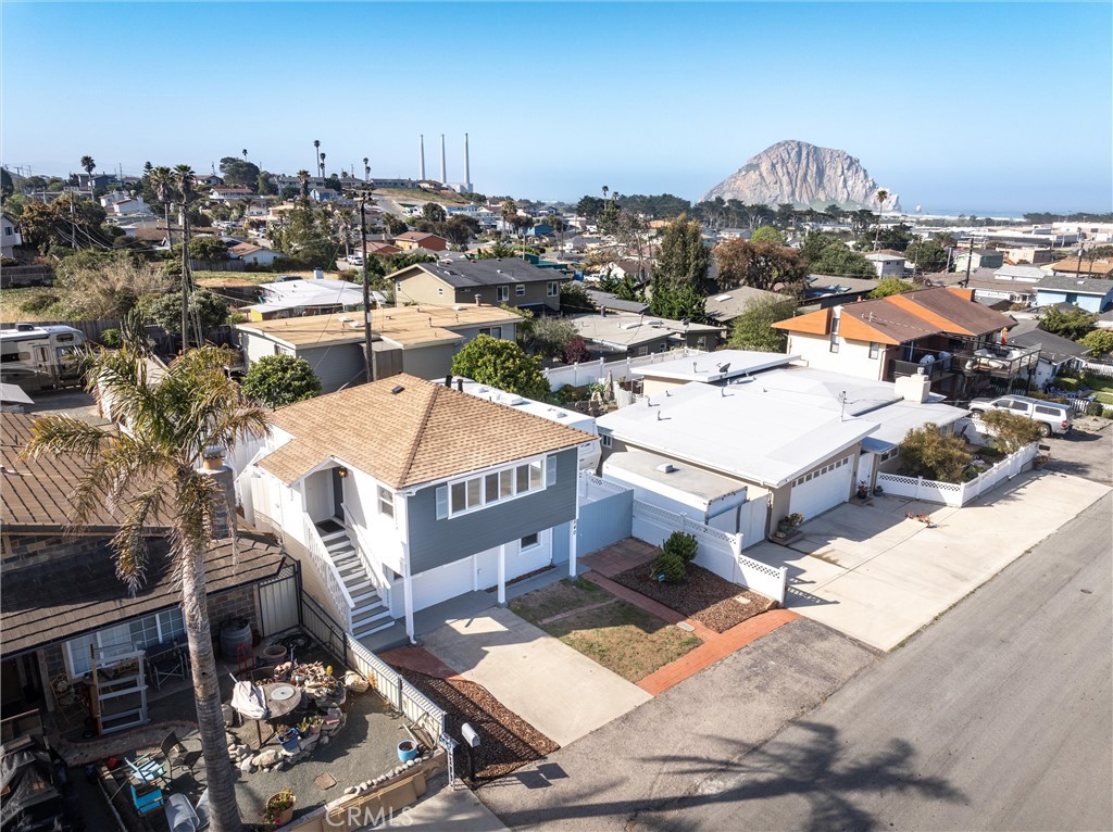 This home offers several options. Currently two one bedroom units with an additional art studio/bonus unit and separate laundry room with third bathroom. Has recently been updated inside and out with new flooring, paint, windows and ceiling fans. Downstairs features new granite kitchen counters and gas stove with a quiet landscaped yard for outdoor enjoyment. Upstairs is open and bright with some ocean and rock views and a spacious sunny deck. Great location convenient to restaurants, schools and park.