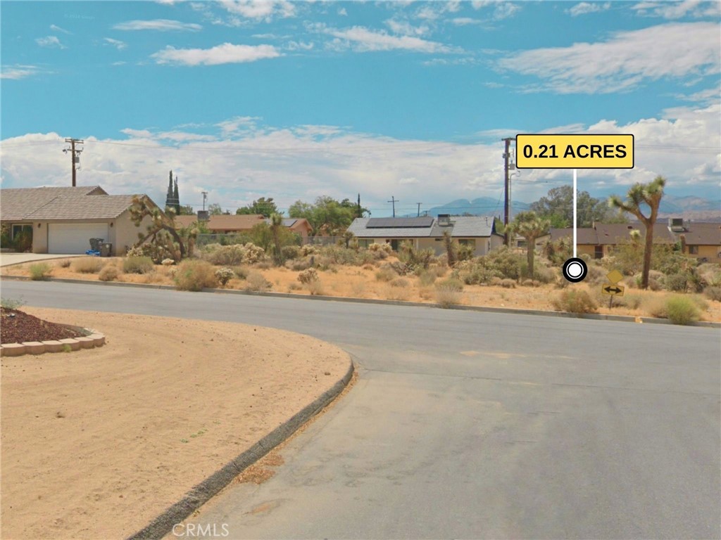 Affordable and flexible terms: Seller Financing Available with as little as $5k down. Here’s a chance to build your dream home or start a profitable vacation rental in the highly desirable Western Hills Ranchos neighborhood of Yucca Valley. This 0.22-acre lot offers a peaceful desert setting surrounded by well-maintained, beautiful homes, perfect for those looking for a quiet, established community with charm and quality. With flat, build-ready land and utilities close by, getting your project started is that much easier. Only about a 10-minute drive from Joshua Tree National Park’s west entrance, you’ll have easy access to some of the most iconic hiking, climbing spots, and desert views in the region. Grocery stores, dining, and shopping in central Yucca Valley are less than 5 minutes away, while Palm Springs is about a 40-minute drive for more options. Outdoor enthusiasts will enjoy being close to rock climbing, hiking, mountain biking, and stargazing under some of the clearest night skies. Whether you’re planning to build yourself or create a space for guests, this lot is an ideal location for a quiet desert escape, a stylish Airbnb, or a long-term home in a neighborhood that more people are starting to notice. The desert real estate market has been growing, with more people seeking second homes or vacation rentals. If you’ve been waiting for the right place to build in Yucca Valley, this could be it. APN: 0588-703-13-0000. Address is not a real address and is for marketing purposes only. GPS: 34.11939, -116.37951