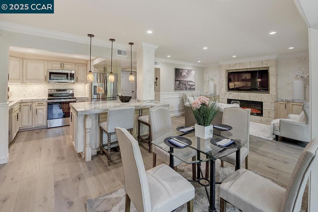 TURNKEY & FULLY FURNISHED (ALL FURNITURE INCLUDED, EXCEPT FOR AIR BEDS STAGED FOR PRESENTATION). Step into this Tuscan-inspired Sonoma, thoughtfully remodeled with care and attention to detail. From the moment you walk in, you’ll notice the character—classic wainscoting, rich engineered hardwood floors, and sleek porcelain counters that tie the kitchen together. A dual-zone wine fridge is ready for your favorite vintages, and a Samsung 65" TV is already in place for cozy nights at home. The primary bathroom was designed with care, featuring a dual vanity, walk-in shower with waterfall head, custom seat, and a fog-free beauty mirror with adjustable lighting. The guest bathroom carries the same attention to detail with clean, timeless updates. An enclosed balcony adds bonus space that can be anything you want it to be—an office, a reading corner, or even a sun-filled art room. And just outside your door, you’re right across from the Hillside Clubhouse with pool, lawn bowling, table tennis, and plenty of ways to stay active and connected. This isn’t just a home that’s been remodeled—it’s a space that’s been reimagined for everyday living and enjoyment. Just bring your suitcase and start living the Rossmoor lifestyle.