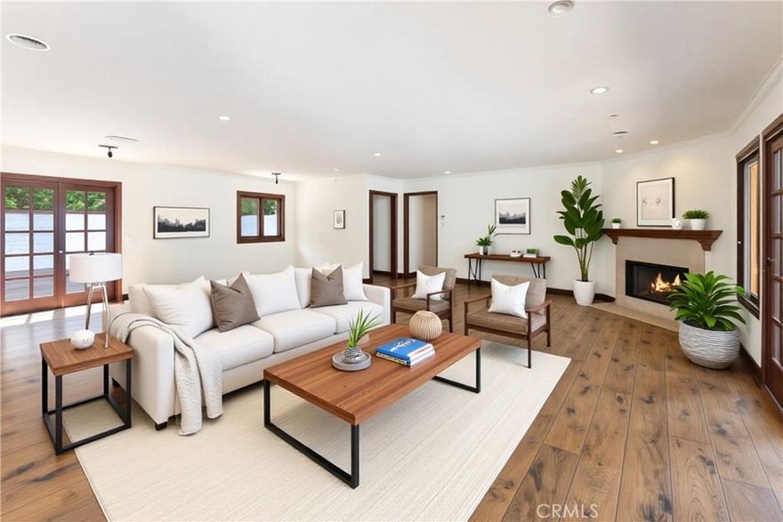 Welcome to 16350 Mandalay, a private retreat in the coveted Encino Hills. This gated residence offers seamless access to the Westside while providing tranquility and sweeping valley views. Inside, the home boasts a spacious open floor plan with soaring ceilings, a generous living room with hardwood floors and a cozy fireplace, plus a beautiful open kitchen featuring tons of storage space and a large island. The private primary suite includes a walk-in closet and serene outlooks, making it the perfect escape. Designed for entertaining, the home opens to expansive decks, a sparkling pool, and beautiful canyon views. Whether you’re hosting a gathering or enjoying quiet evenings, this home offers the ideal balance of comfort and California lifestyle.