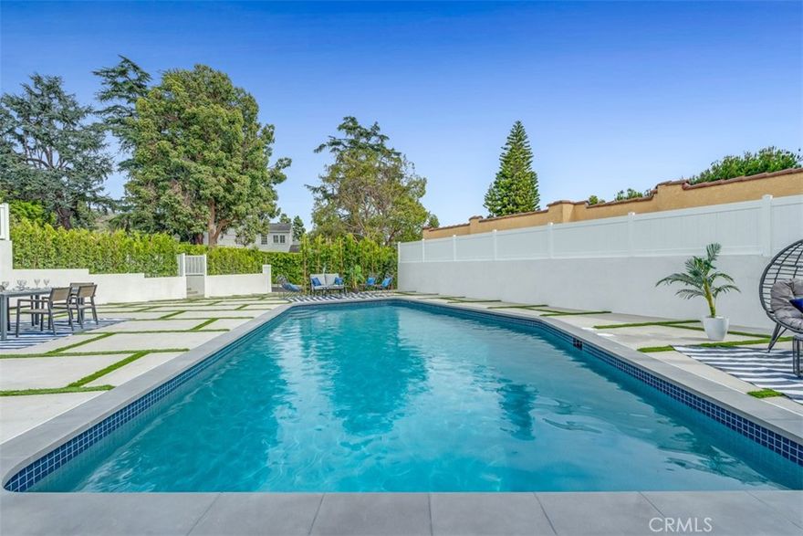 Downtown view.  Location, Location, Location!  Stunningly remodeled corner-lot home on Kenneth Road. The spacious living room, featuring a massive stone fireplace, seamlessly opens to the dining area, breakfast nook, and kitchen—highlighted by a beautiful enclosed glass wine display. This home boasts 4 bedrooms, each with its own private bathroom, plus a total of 5 bathrooms. The remodeled pool adds a luxurious touch. The lower-level family room opens directly to the pool area, making it an ideal space for a pool table, bar, and entertaining guests. No expense was spared in the upgrades: engineered hardwood floors, exquisite Italian tiles from Spain, custom European doors, designer kitchen cabinetry, Hansgrohe faucets, a new roof, all-new plumbing and electrical systems, new sewer lines, and three new HVAC units.  Experience the perfect blend of elegance, comfort, and modern luxury in this exceptional home.