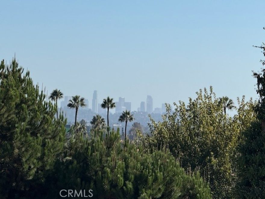 Downtown view.  Location, Location, Location!  Stunningly remodeled corner-lot home on Kenneth Road. The spacious living room, featuring a massive stone fireplace, seamlessly opens to the dining area, breakfast nook, and kitchen—highlighted by a beautiful enclosed glass wine display. This home boasts 4 bedrooms, each with its own private bathroom, plus a total of 5 bathrooms. The remodeled pool adds a luxurious touch. The lower-level family room opens directly to the pool area, making it an ideal space for a pool table, bar, and entertaining guests. No expense was spared in the upgrades: engineered hardwood floors, exquisite Italian tiles from Spain, custom European doors, designer kitchen cabinetry, Hansgrohe faucets, a new roof, all-new plumbing and electrical systems, new sewer lines, and three new HVAC units.  Experience the perfect blend of elegance, comfort, and modern luxury in this exceptional home.