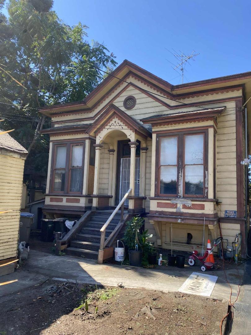 The house on the back of the property was built circa 1886 and is on the city's historic register. It has the house number 417. The structure in the front was built as a grocery store in 1928 and was later used as a bar in the 1970s and 1980s. At some point this structure was given the number 415 - perhaps for mailing purposes. Square footage of the house is approximate. Buyer to verify square footage. Buyer to verify what can be done with the property.