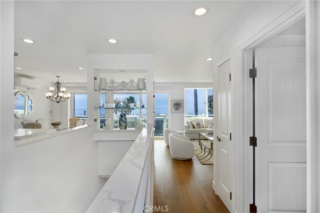 Welcome to 11952 Whalers Lane, a rare opportunity to own a brand-new home in the highly coveted, gated Malibu Bay Club. Completed in 2025 under current building codes and rebuilt from the foundation up, this residence combines modern luxury with coastal living at its finest.
Featuring 2 spacious bedrooms and 3 full bathrooms, the home is designed for comfort and accessibility, complete with a chair lift on the stairs and 4-zone heating and A/C. Expansive windows frame breathtaking ocean views, filling the interiors with natural light. The open-concept layout is highlighted by a built-in bar, custom desk, and contemporary finishes, creating an effortless flow for entertaining and day-to-day living.
A fully owned solar panel system provides energy efficiency, while the sale includes all furnishings, TVs, and even dinnerware, allowing for a truly turnkey experience. Enjoy peace of mind with modern construction, quality craftsmanship, and thoughtful details throughout.
Located in the private Malibu Bay Club, residents enjoy exclusive gated security, beach access, and a serene coastal lifestyle just minutes from Malibu and Ventura. This is your chance to live the dream in a fully reimagined ocean-view retreat.