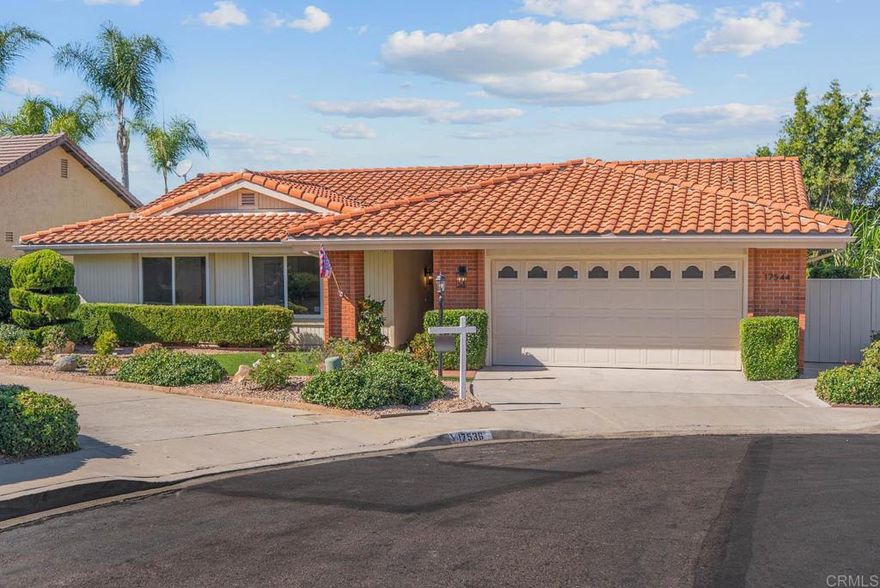 This tastefully updated move-in-ready single-story home with exceptional unobstructed golf course views is located on a quiet cul-de-sac in the 55+ community of Oaks North in Rancho Bernardo. Spanning 2,102 sq. ft., the property offers 3 bedrooms, a spacious bonus office/den with French doors - easily used as a 4th bedroom - and 2 full bathrooms. Meticulously remodeled and freshly painted inside, the home features an open-concept layout with vaulted ceilings in the living and dining rooms, luxury engineered wood flooring and a fireplace. Central AC and heating, along with dual-pane windows and sliding doors throughout, provide comfort year-round. The remodeled kitchen offers abundant new cabinetry, granite countertops and stainless steel appliances. Both the primary and guest bathrooms include walk-in showers. Additional highlights are an attached 2-car garage with washer and dryer hookups and a newer water heater. The private low-maintenance backyard is complete with a covered patio and is perfect for entertaining, relaxing and enjoying the cooling breezes, panoramic golf course views and beautiful sunsets. The low annual HOA fee provides access to community amenities including a heated swimming pool, clubhouse, pickleball courts, lawn bowling, paved walking paths and social activities such as happy hours, yoga, bridge and movie nights. Conveniently located near multiple golf courses, the I-15 freeway, banks, restaurants and shopping centers, this home combines comfortable living with an active community lifestyle.