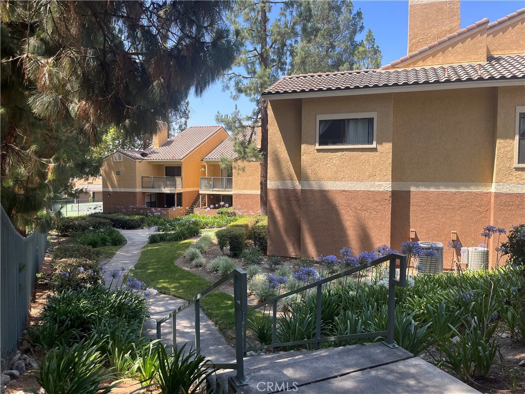 Step into this well-maintained 2-bedroom, 1-bath condo, perfectly positioned in a secure, gated neighborhood just moments from schools, shopping, and dining. With 2 (two) assigned parking spaces—a coveted convenience—this home blends privacy with effortless living. Inside, you’re greeted by an open living space where the family room, dining area, and kitchen flow seamlessly together. Recessed lighting adds a modern touch, while sliding door to the patio bathes the space in natural light. The kitchen offers functionality with ample storage. Both bedrooms are generously sized, sharing a well-appointed jack-and-jill bathroom with a shower/tub combo—perfect. The second-floor location ensures peace and quiet, with no neighbors above.
Residents enjoy resort-style amenities, including three saltwater pools, spa, tennis court, and shared laundry facilities— plus the added convenience of in-unit laundry. HOA fees include water and trash.