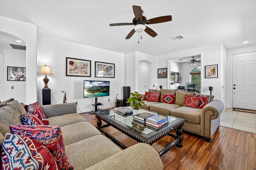 Welcome to this charming San Ysidro floor plan offering 1,463 sq. ft. of living space in the active 55+ community of Sun City Shadow Hills. Nestled on a quiet cul-de-sac, this thoughtfully designed home features an open great room with recessed lighting, laminate flooring, and abundant natural light that enhances the inviting atmosphere. The kitchen boasts granite countertops, rich cabinetry, and bar seating at the breakfast counter, flowing seamlessly into the dining area with sliding glass doors that open to the backyard. The spacious primary suite includes a walk-in closet and en suite bath, while the guest bedroom and additional bath provide comfort for visitors. Step outside to enjoy the extended covered patio and low-maintenance landscaping, creating a private outdoor retreat. Just a 60-second walk from the dog park, this home is perfect for pet owners. As a resident of Sun City Shadow Hills, you'll have access to two clubhouses, two championship golf courses, fitness centers, pools, tennis and pickleball courts, and countless clubs and social activities--making every day feel like a vacation.