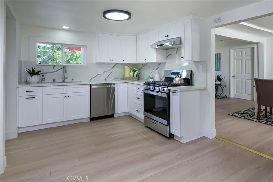 Light, Bright & Move-In-Ready! Fully Remodeled Interior ... this 3-Bedroom Single-Story Home is Ready for its Next Owner! Built in 1912 & Tucked Away on a Small Private Cul-De-Sac Street with Loads of Small-Town Feel & Charm - Wrap-Around Covered Front Porch Invites You Into this Property Boasting All NEW Flooring, Baseboards, Full Interior Paint, Recessed Lighting, Dual-Pane Windows, Interior Doors & More - Gorgeous Remodeled Kitchen Features New White Soft-Close Cabinetry, Quartz Countertops with Full Backsplash, and Brand New (never used) Stainless-Steel Appliances, Including Dishwasher, Microwave and Gas Cooktop/Oven with Hood - Kitchen is Open to the Living/Dining Area, a Very Modern & Open Floorplan & Design - Three Generous Bedrooms (2 have en-suite bathrooms) and Three Fully Remodeled Bathrooms All Offering New Tile Flooring, New Toilets, Quartz Vanities & Tub/Showers - Convenient Inside Laundry Area - 2-Car Detached Garage, Plus HUGE Storage Shed - New Energy-Efficient HVAC System - Backyard is Large & Very Private with Tons of Potential For Future Use .... Fruit Trees Galore, Including Apple, Pomegranate, Lemon, Lime & an Avocado Tree in the Front - No Mello Roos Tax - No HOA Dues - Award-Winning Placentia-Yorba Linda School District, Zoned for Rose Drive Elementary, Yorba Linda Middle & El Dorado High - Centrally Located with Easy Access to the 91/57 Freeways