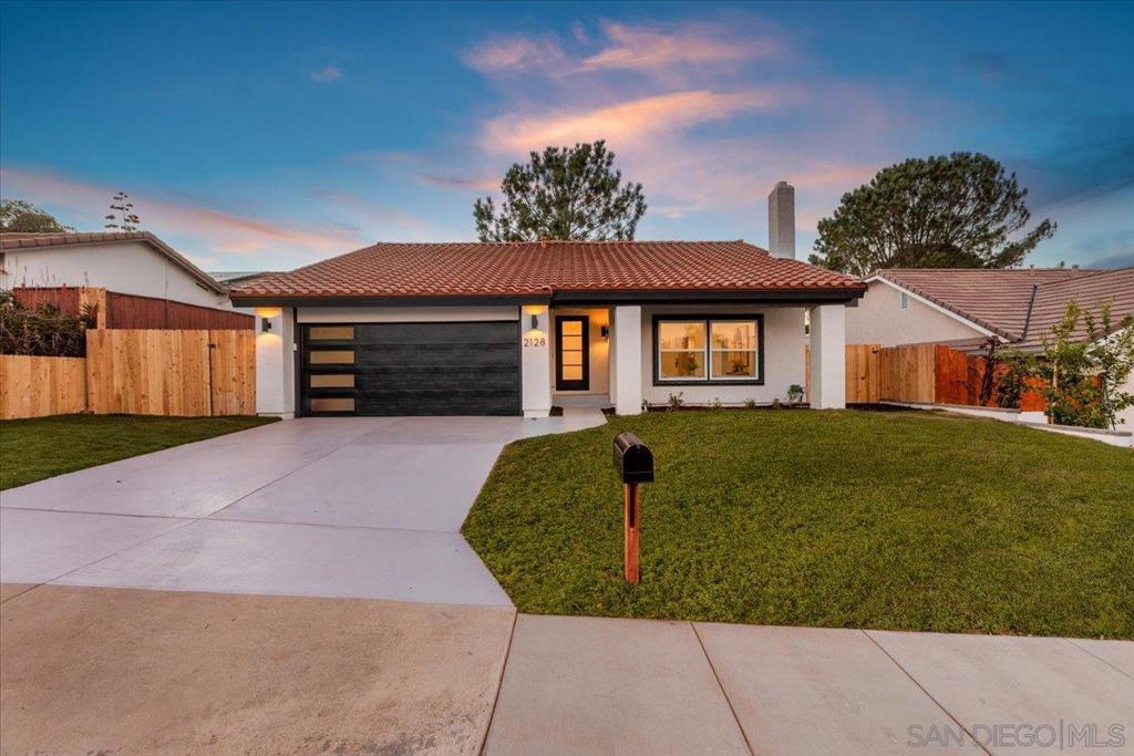 Don’t miss this rare coastal gem nestled in the heart of Village Park. This fully remodeled four-bedroom, four-bathroom home blends modern luxury with thoughtful design, all set on a generous 6,000 sq. ft. lot in one of the area's most sought-after neighborhoods. Step inside to be welcomed by soaring vaulted ceilings and an abundance of natural light that fills the spacious living room. The open-concept floor plan centers around a stunningly designed chef’s kitchen, complete with waterfall-edge quartz countertops, custom light oak cabinetry, designer quartz backsplash, and top-of-the-line stainless steel appliances. A large island with integrated seating and statement pendant lighting makes it perfect for both everyday dining and entertaining. Seamless indoor-outdoor living is yours to enjoy, with panoramic 12’ cantina style sliding glass doors opening to a beautifully landscaped backyard. Wide-plank luxury vinyl flooring and a sophisticated neutral palette create a warm, contemporary atmosphere throughout the home. The flexible layout includes primary suites on both the main and upper levels, offering convenience and privacy, along with three additional bedrooms ideal for family, guests, or a home office. Every bathroom has been meticulously updated with custom vanities, premium fixtures, and designer finishes. Located on a quiet street just minutes from award-winning schools, scenic beaches, parks, top-rated dining, and shopping—this turnkey home is the perfect balance of comfort, style, and location.