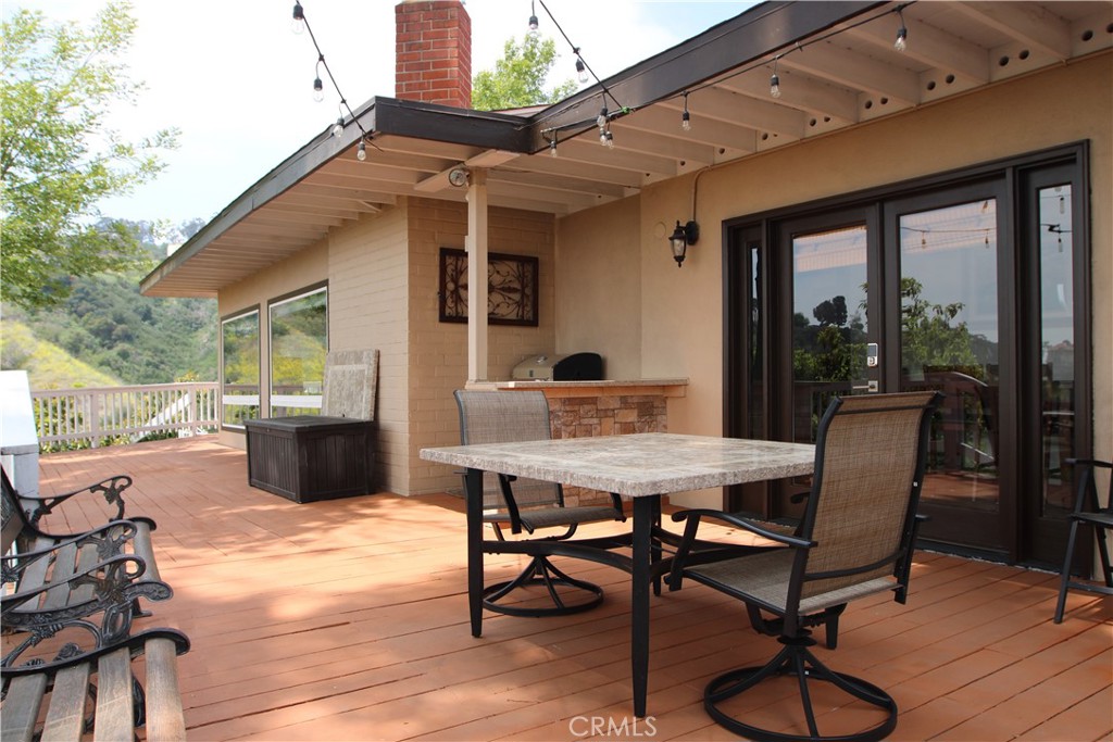 Welcome to your private sanctuary in the peaceful hills of La Habra Heights. This move-in-ready 3-bedroom, 2-bathroom home is a nature lover’s dream, offering panoramic views stretching to Long Beach and Catalina Island on clear days—all visible right from your kitchen window.
Surrounded by vibrant, low-maintenance landscaping—including ice plants, succulents, bougainvillea, birds of paradise, plumeria, daisies, and fruitful avocado trees—this property offers a lush and serene atmosphere perfect for those who cherish outdoor living. The expansive backyard deck and hot tub provide the ultimate setting for relaxation or entertaining while soaking in stunning 180+ degree vistas.
Inside, you’ll find spacious bedrooms with generous closets, fresh interior paint, soaring high ceilings, and warm, well-maintained laminate flooring. The classic kitchen design blends beautifully with the home's inviting character. A two-car detached garage and a tankless water heater add modern convenience to this peaceful escape.
Whether you're an artist, nature enthusiast, or simply seeking a quiet retreat that feels like living in your own private forest—with the sounds of birds and wildlife all around—this home delivers a truly special experience. Just minutes away from the scenic hacienda country club, this location combines privacy with proximity to amenities.
Bonus: Sellers are open to including most furniture and appliances upon request.
Don’t miss this one-of-a-kind property—your dream lifestyle awaits.