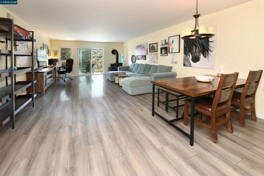 Welcome to this beautifully appointed 2-bedroom, 2-bath home offering a bright open floor plan & breathtaking mountain views. The spacious living room flows seamlessly into a dedicated dining area & updated eat-in kitchen —perfect for both everyday living & entertaining.  Enjoy year-round comfort with central heat & air conditioning, plus the convenience of in-unit full-size laundry. A private balcony provides the perfect retreat to relax & take in peaceful, tree-lined & mountain views. Additional perks include LVP flooring (no carpet), newer stove, newer dishwasher & newer flooring in kitchen, plantation shutters, new laundry hook-ups & washer/dryer.  A private storage room & covered carport parking are just steps away.  Ideally situated as a quiet end unit, this home is close to everything Moraga has to offer—top-rated schools, Rheem Valley Shopping Center, scenic trails, Moraga Country Club, & St. Mary’s College. With its blend of tasteful design, functionality, & unbeatable location, this property delivers the perfect balance of comfort, convenience, & lifestyle. Don’t miss this must-see opportunity!  HOA fees include water & garbage.