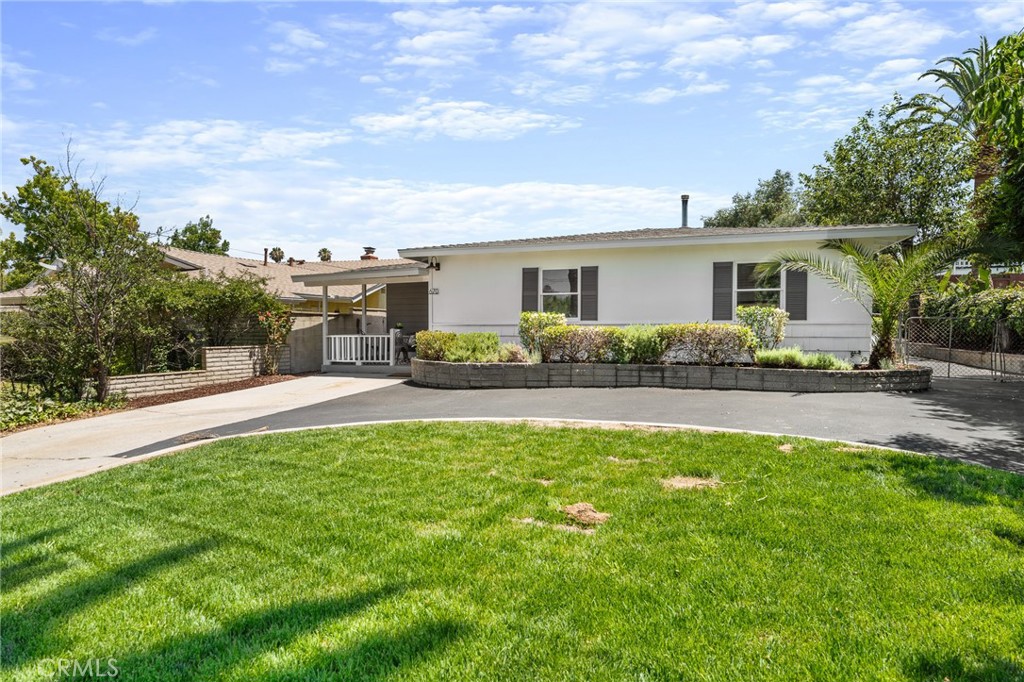 Beautifully updated mid-century modern home featuring 4 spacious bedrooms and 2 bathrooms. Step into a large, inviting living room with a cozy fireplace and an open floor plan perfect for entertaining. The brand-new kitchen is a showstopper—boasting quartz countertops, a stainless steel farmhouse sink, and modern, trendy fixtures throughout. Fresh interior paint, new luxury vinyl plank flooring, and plush carpet in the bedrooms make this home truly move-in ready.
Ideal for multigenerational living, the layout offers two bedrooms and one bathroom on each side of the home for added privacy. Enjoy the convenience of an indoor laundry room, a welcoming front porch, and French doors that lead to a covered patio in the backyard—perfect for relaxing or entertaining.
The property offers plenty of parking with a circular driveway and oversized detached garage, with ample space to add an ADU or convert the garage into additional living quarters.
Conveniently located within walking distance to shopping, schools, and Ford Park—plus just a short drive to charming and historic Downtown Redlands. Pack your bags—this one is ready to welcome you home!