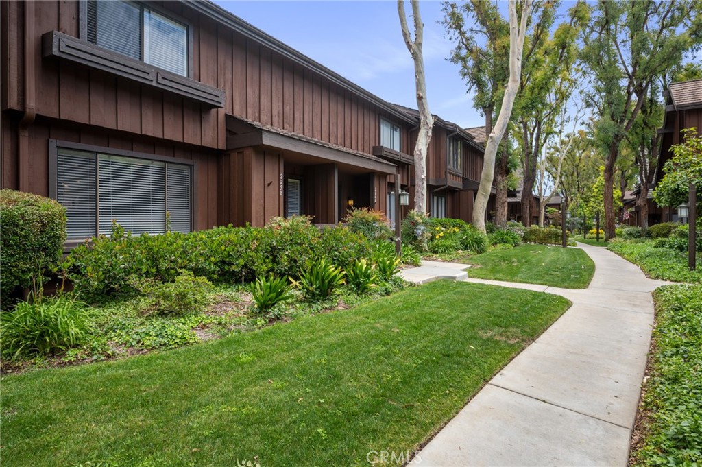 This is the opportunity you've been waiting for! Tucked away in the back row of the highly desirable Gardens community, this sharp 3 bedroom, 2.5 bathroom unit is updated and move-in ready! Main-level features a living and dining room with an updated kitchen that leads to an enclosed private patio with outdoor string lighting that is perfect for entertaining. Staircase with large enclosed storage area and laminate floors throughout, with tiled kitchen and dining room. The second level features all 3 bedrooms including a master ensuite with a spacious walk-in closet. Front door and all windows were recently replaced with new dual paned windows. Back alley includes plenty of parking which is convenient for visitors or guests. Short walk through the beautiful greenbelt to the nearby pool and tennis courts make this a prime location away from traffic. With nearby shopping, restaurants, and schools, this gem is ready for the next owner!