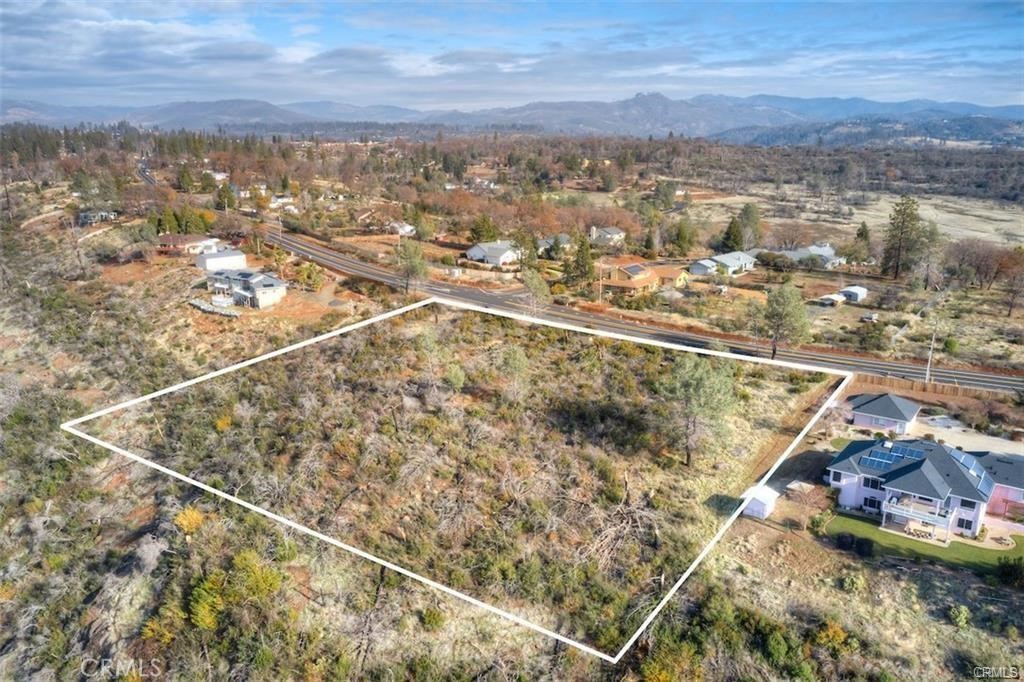 Large view acreage parcel in lower Paradise close to Lime Saddle Marina and Lake Oroville. Seller did major work towards a parcel split and the process to split this parcel into two beautiful, accessable view parcels, was almost complete, the only items left for final approval of the lot division are the road approach, the final pins, and the final map. This parcel is located on lower Pentz Road near other upscale homes, and easy access to the Lake and Valley. Enjoy unobstructed canyon views and beautiful sunsets. If you have been looking for a way to have two homes on contiguous parcels, then this is the parcel for you. Across the street from Lago Vista Way. Perc test map and tentative map are in supplements.