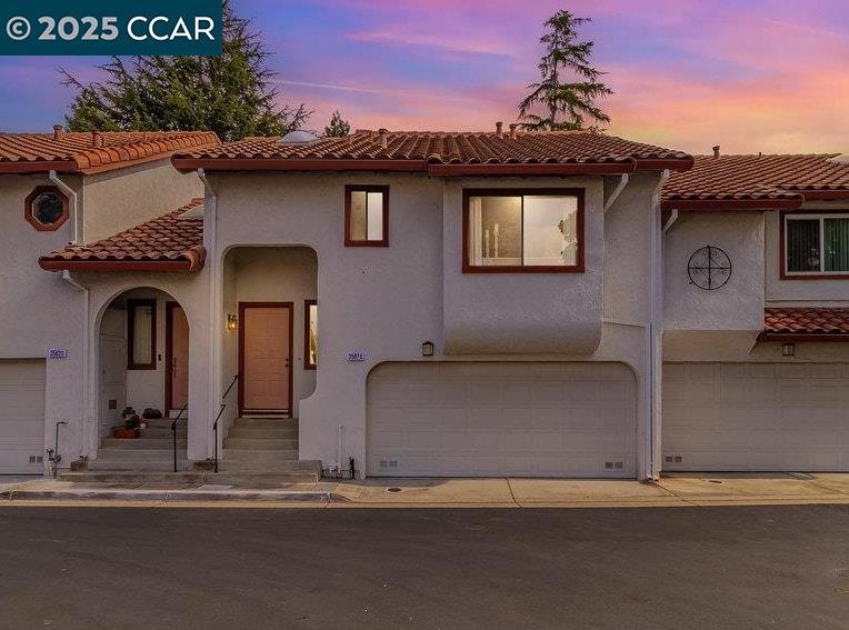 Welcome to 35624 McCarty Common! This beautifully updated 2 bedroom, 2.5 bath townhouse offers a thoughtfully designed living space in a prime Fremont location. Step inside to soaring vaulted ceilings and a bright entryway highlighted by a skylight creating an open and airy feel from the moment you arrive. This townhome showcases brand new luxury vinyl flooring and fresh interior paint throughout creating a modern and move-in ready atmosphere. The inviting living room features a cozy fireplace perfect for relaxing evenings at home. The kitchen is appointed with sleek quartz countertops, ideal for both everyday cooking and entertaining. Upstairs, you’ll find two spacious bedrooms, each with their own private bathroom featuring dual sink vanities. A full size washer and dryer are also conveniently located upstairs, making laundry day a breeze. Enjoy the outdoors on your private backyard patio with pavers and greenery. Perfect for relaxing, dining or hosting. The attached 2 car garage provides convenience and extra storage shelves. With its blend of style, comfort, and function, this home is a wonderful opportunity you won’t want to miss! Just minutes from BART, top rated schools, dinning, shops, Dumbarton Bridge, Hwy 880, gym, parks and hiking trails.
