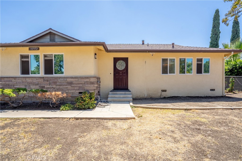 Presenting an exceptional lease opportunity in this meticulously upgraded single-story residence, designed for those who appreciate modern luxury and private living. This 1,234 sq. ft. home features 3 spacious bedrooms and 2 elegantly appointed bathrooms, all situated on a sprawling and fully secured 8,247 sq. ft. lot. Inside, you are greeted by an open, sun-drenched floor plan adorned with rich hardwood flooring, custom trim work, and designer lighting. Spacious dining area and family room provide ample space for entertaining. The chef-inspired kitchen is equipped with stainless steel appliances, expansive quartz countertops, and custom cabinetry, offering both style and functionality. The owner has spared no expense in the bathrooms, which are finished with custom vanities, quartz surfaces, and walk-in showers featuring custom tile work and frameless glass enclosures. Practical comforts include dual-pane windows, recessed lighting throughout, and a two-car garage. Outside, your private oasis awaits, completely enclosed by a gated fence with an automatic entry for secure and convenient vehicle access, complemented by ample lawn space for recreation and entertaining. This premier property combines serene living with unmatched convenience, offering quick and easy access to major freeways, fine dining, and premier shopping destinations.