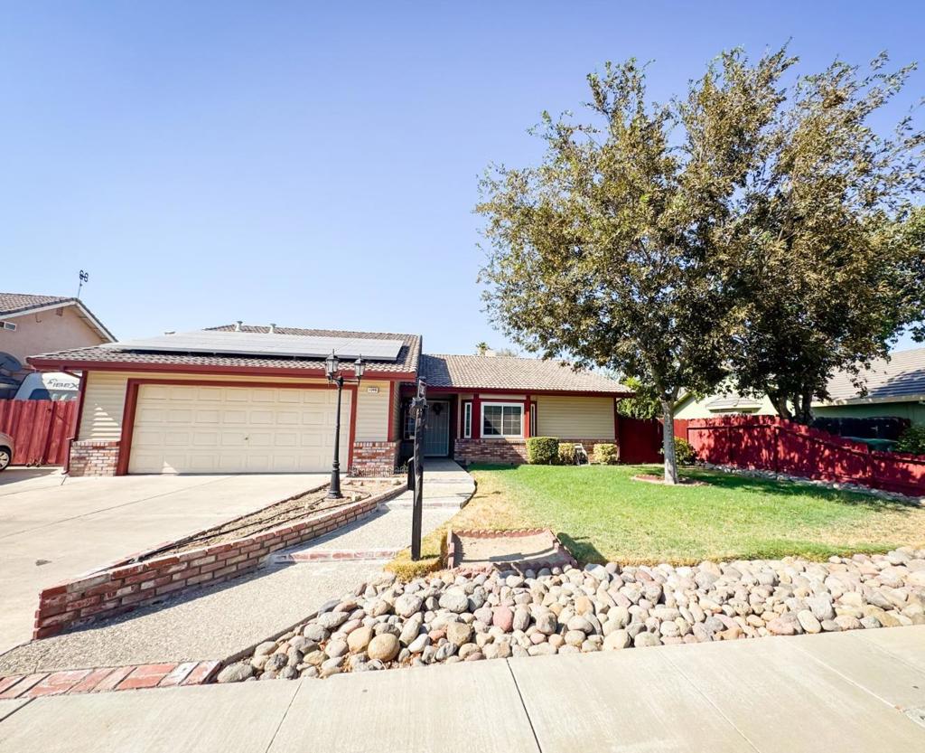 Welcome to this charming 3-bedroom, 2-bathroom home nestled in the vibrant city of Los Banos. Spanning 1,547 sq ft, this residence offers a comfortable and functional layout that also comes equipped with solar panels. The kitchen is a culinary delight, equipped with modern appliances and ample counter space, perfect for meal preparation and family gatherings. Enjoy the warmth of the cozy fireplace located in the separate family room, ideal for relaxing evenings. The home features a mix of carpet and laminate flooring, providing both comfort and style throughout the living spaces. The property also boasts a spacious 2-car garage, offering plenty of storage and parking space. Situated on a 7,256 sq ft lot, this home falls within the Los Banos Unified School District. Additional amenities include central AC and central forced air heating, ensuring year-round comfort and also comes equipped with solar panels. Don't miss this opportunity to own a lovely home in the Ranchwood neighborhood!