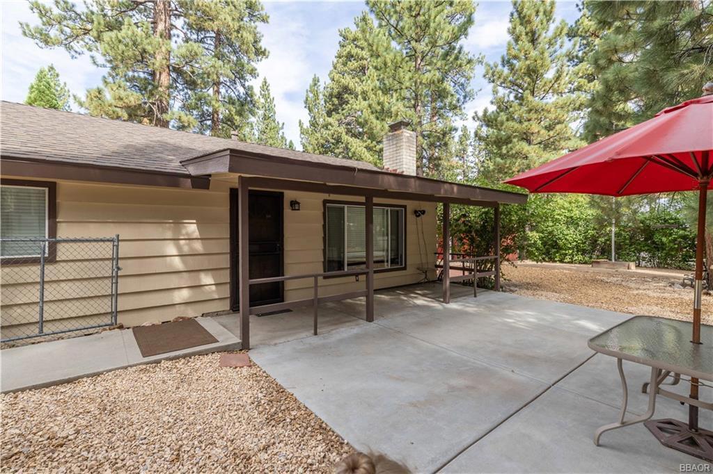 This charming corner-lot cabin is move-in ready and full of recent upgrades, including the kitchen, bathroom, windows, ceiling fans, flooring, and water heater (all completed in 2019). The open-concept kitchen, living, and dining areas flow seamlessly into an inviting outdoor entertainment space--great for gatherings. A convenient pantry/mud room off the kitchen provides additional storage. Enjoy excellent access to Bear Mountain, local grocery stores, and the convention center. The fenced yard offers parking inside the gates and plenty of room to relax and unwind. Don't miss your opportunity to own this beautifully updated Big Bear gem!