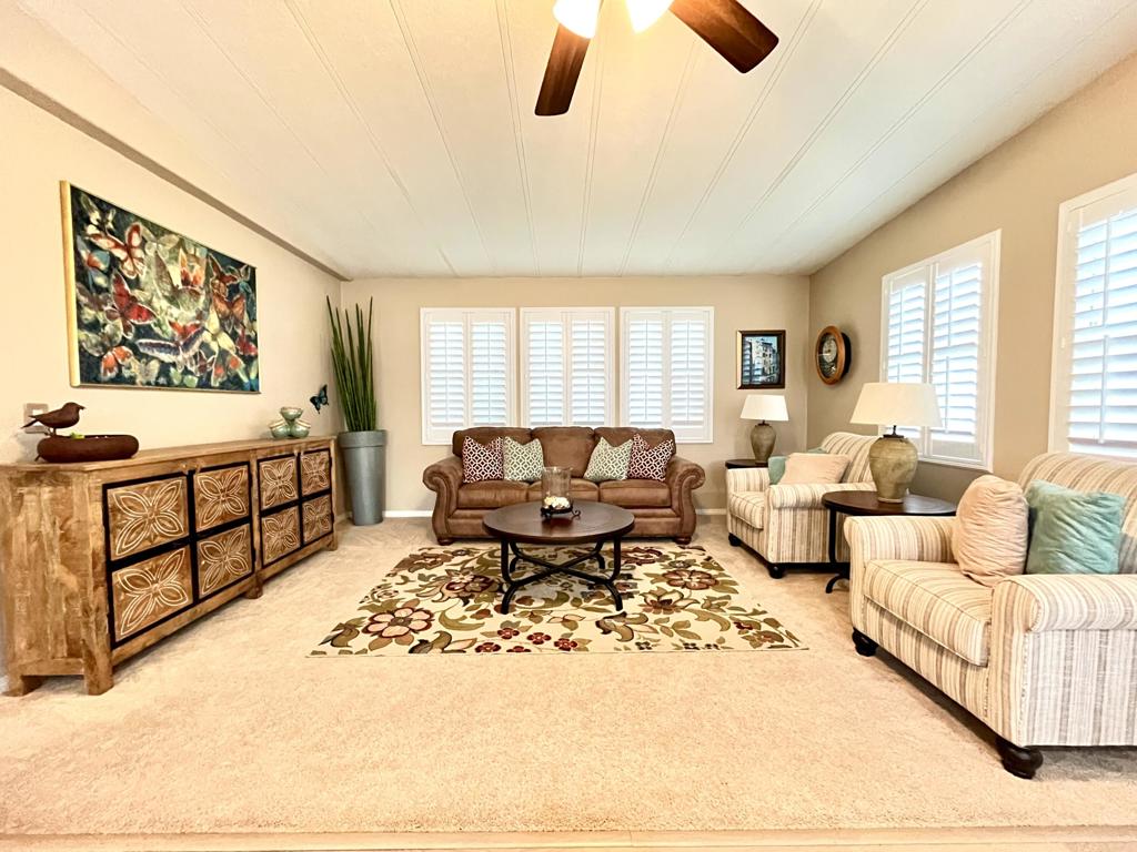 Long-Term Lease: $2,700/month | Short-Term Lease (3-Month Minimum): $2,950/month | Call for custom lease termWelcome to this beautifully maintained 2-bedroom, 2-bath manufactured home), offering 1,440 sq. ft. of stylish living space in the desirable Palm Desert Greens Country Club--a guard-gated 55+ community with resort-style amenities. FULLY FURNISHED. Enjoy an open floor plan with upgraded double-pane windows and shutters, ceiling fans throughout, and a well-maintained HVAC system for year-round comfort. The kitchen features ample counter space and all appliances included, while a bonus room offers flexibility for an office, hobby space, or guest retreat.Step outside to a private backyard--the only one on the street--featuring low-maintenance astro turf, perfect for relaxing or entertaining. A front patio, storage shed, and solar system add to the convenience and efficiency of this move-in ready home.Community amenities include:-18-hole executive golf course -3 pools and spas -Clubhouse with restaurant and bar- Tennis, pickleball, and bocce courts -24-hour guard-gated securityDon't miss this rare opportunity to live in comfort and style in one of Palm Desert's most sought-after 55+ communities.Apply here: https://apply.link/_iDIWgs