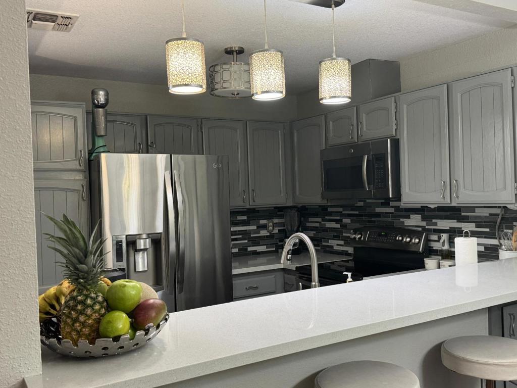 Welcome to this charming 2-bedroom, 2-bathroom condo. Down stairs unit. With 1,030 square feet, this property offers a comfortable living experience. The kitchen is equipped with modern amenities, featuring a convenient breakfast bar and dining area. Enjoy the cozy ambiance provided by the fireplace, complemented by the efficient central forced air-gas heating and central AC, ensuring comfort all year round. The home boasts durable laminate and tile flooring throughout, adding a touch of elegance and easy maintenance. Laundry is conveniently located inside, adding to the home's practicality.  Close to shopping and freeways.