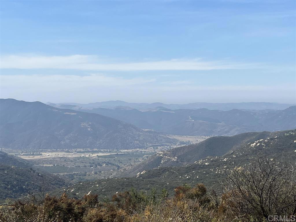 Almost 10 Acres lot in a Gorgeous location to build your dream home in this lovely gated community off Pala Road. Beautiful area looking high up over the Temecula Valley with fabulous views. This area is only minutes from Temecula's Pechanga Casino, Great Oak schools, sports center and lots more. This community has beautiful homes on acreages. There are paved and unpaved roads in spots and in this private community. Water and Electricity available at the site. Water meter reserved, but not in. Perk Test on file. Seller willing to finance with the right offer.