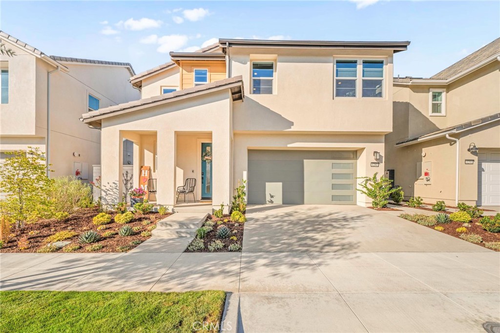 Welcome to an exceptional opportunity to own a nearly new home in the highly desirable Rienda neighborhood of Rancho Mission Viejo. This beautifully designed home offers 2,065 sq. ft. of luxury living with 3 bedrooms, 2.5 bathrooms, and a versatile loft. Situated on a rare oversized lot, this home offers added space and privacy. You'll enjoy energy efficiency and long-term savings with a fully paid solar system, tankless water heater, and whole-house fan. Smart home features include a Ring doorbell, smart thermostat, and smart light switches for added convenience. The inviting open-concept layout seamlessly connects the living room, dining area, and kitchen, making it perfect for both entertaining and everyday living. The chef’s kitchen features elegant quartz countertops, a custom backsplash, an oversized island, walk-in pantry, and stainless steel appliances, including a gas range with griddle. Shaker-style cabinets extend to the ceiling, providing ample storage and a polished look. A convenient half bath is also located downstairs. Upstairs, the loft offers flexible space for a home office, playroom, or media room. The spacious primary suite is a peaceful retreat with walk-in closet with custom built-in storage, dual sinks with quartz counters, a dedicated vanity, and an upgraded frameless walk-in shower. Two generously sized secondary bedrooms share a full bath with dual sinks and a shower/tub combo. Additional upgrades include luxury vinyl plank flooring, custom paint, plantation shutters, and electronic blinds. The backyard is a true private escape with low-maintenance landscaping and a covered California patio with ceiling fan. With no rear neighbors, you’ll enjoy peace and serenity. The garage includes epoxy floors and a smart garage door opener. Living in this award-winning planned community means access to amenities like multiple resort-style pools, clubhouses, fitness centers, scenic trails, sports parks, pickleball courts, firepits and a community farm. With top-rated schools, this is more than a home, it’s a lifestyle and a place to thrive.