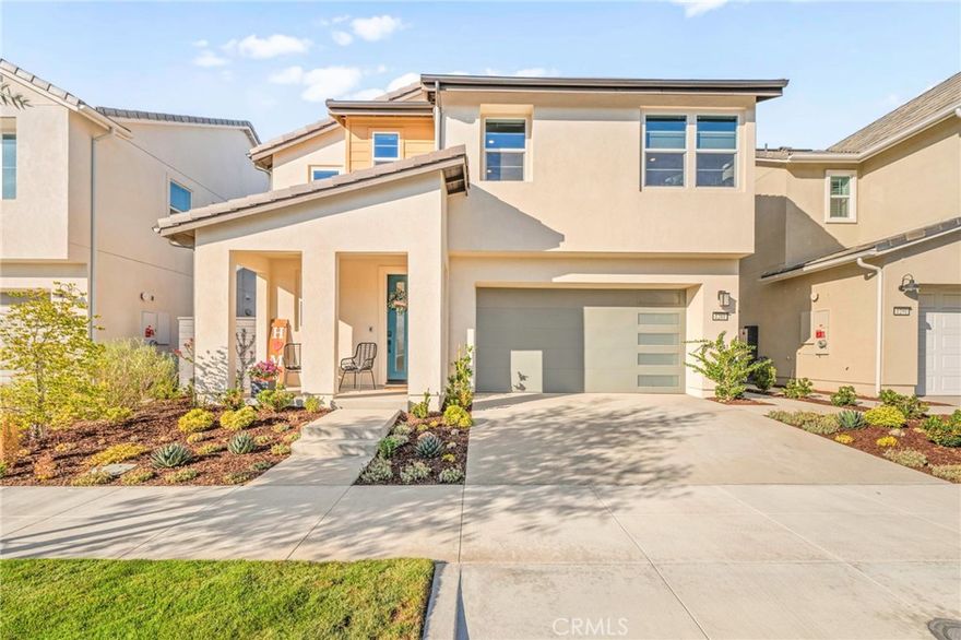 Welcome to an exceptional opportunity to own a nearly new home in the highly desirable Rienda neighborhood of Rancho Mission Viejo. This beautifully designed home offers 2,065 sq. ft. of luxury living with 3 bedrooms, 2.5 bathrooms, and a versatile loft. Situated on a rare oversized lot, this home offers added space and privacy. You'll enjoy energy efficiency and long-term savings with a fully paid solar system, tankless water heater, and whole-house fan. Smart home features include a Ring doorbell, smart thermostat, and smart light switches for added convenience. The inviting open-concept layout seamlessly connects the living room, dining area, and kitchen, making it perfect for both entertaining and everyday living. The chef’s kitchen features elegant quartz countertops, a custom backsplash, an oversized island, walk-in pantry, and stainless steel appliances, including a gas range with griddle. Shaker-style cabinets extend to the ceiling, providing ample storage and a polished look. A convenient half bath is also located downstairs. Upstairs, the loft offers flexible space for a home office, playroom, or media room. The spacious primary suite is a peaceful retreat with walk-in closet with custom built-in storage, dual sinks with quartz counters, a dedicated vanity, and an upgraded frameless walk-in shower. Two generously sized secondary bedrooms share a full bath with dual sinks and a shower/tub combo. Additional upgrades include luxury vinyl plank flooring, custom paint, plantation shutters, and electronic blinds. The backyard is a true private escape with low-maintenance landscaping and a covered California patio with ceiling fan. With no rear neighbors, you’ll enjoy peace and serenity.  The garage includes epoxy floors and a smart garage door opener. Living in this award-winning planned community means access to amenities like multiple resort-style pools, clubhouses, fitness centers, scenic trails, sports parks, pickleball courts, firepits and a community farm. With top-rated schools, this is more than a home, it’s a lifestyle and a place to thrive.