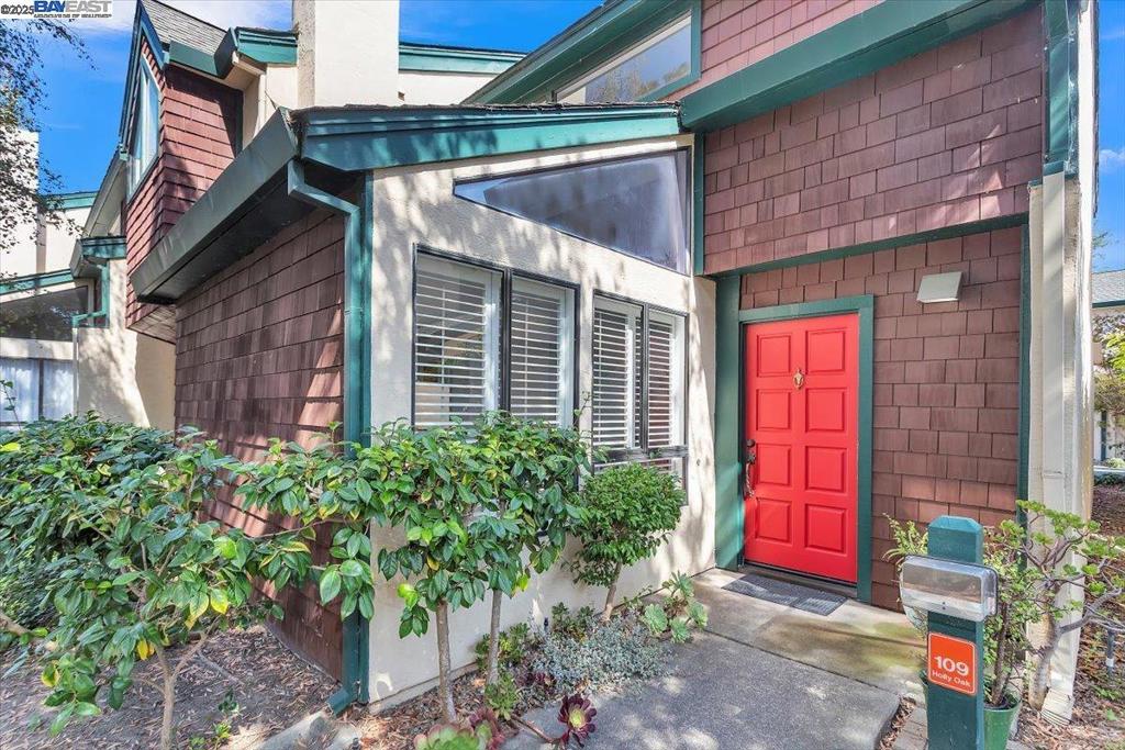 Welcome to a beautifully designed townhome in the heart of Harbor Bay Isle. Spanning 1,534 square feet, this two-bedroom, 2.5-bath residence offers generous living space, vaulted ceilings, and a wonderful layout that floods with natural light. Enter into a spacious living room featuring extra high ceilings, plank flooring, fireplace and formal dining room. The eat-in kitchen is stylish and functional, equipped with solid surface counters, and space for a breakfast nook or lounge area. Patio off the kitchen is idea for eating outdoors. Both bedrooms full suites includes spacious bathrooms with double sink long vanities. The primary suite includes vaulted ceilings, walk-in closet and slider to patio, an extended outdoor living space. The second suite bedroom is bright and inviting, perfect for guests or office use. Additional highlights: interior access to a two-car attached garage with washer and dryer, access to lush landscape, community amenities including pool and spa located on the lagoon, scenic lagoon walking trails, and the convenience of nearby (walkable) amenities such as groceries, restaurants, parks, sports courts, library, Starbucks, pet grooming, and more. Located just minutes to top rated schools, airport, SF ferry, freeway access, and public transit lines.