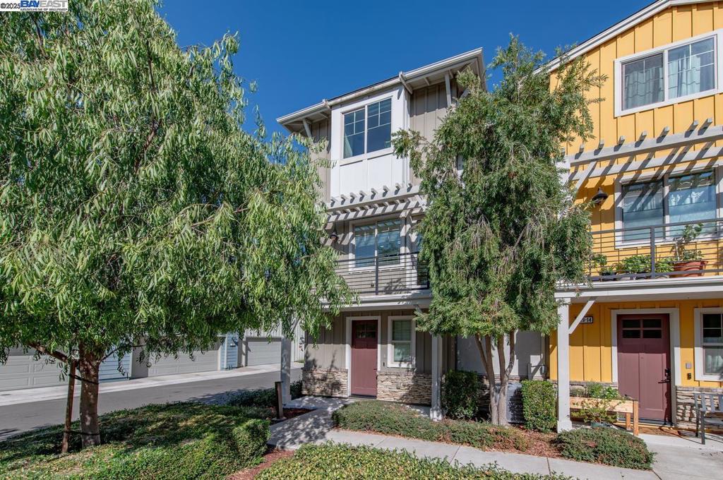 This gorgeous former model home is filled with designer upgrades and modern touches throughout, offering both style and comfort in every detail. As an end unit, it boasts abundant natural light and beautiful Livermore hill views! The first floor welcomes you with a charming entryway, ideal for a mud-room, and a spacious side-by-side two-car garage. Upstairs, the open-concept second floor features a bright and expansive living area with upgraded flooring and a convenient half bath. The chef’s kitchen is truly a showpiece, showcasing top-of-the-line GE appliances, sleek quartz countertops, and custom sage green shaker cabinets, perfect for entertaining or everyday living. The third floor also includes a generous bedroom and full attached bath. Your private master retreat awaits on the same level, complete with a spacious bedroom, luxurious en-suite bathroom, and a walk-in closet designed for modern living. The Sage community offers resort-style amenities including a sparkling pool with shaded cabanas, a state-of-the-art fitness center, bocce courts, hot tub, yoga lawn, ping pong, and inviting outdoor entertaining spaces.