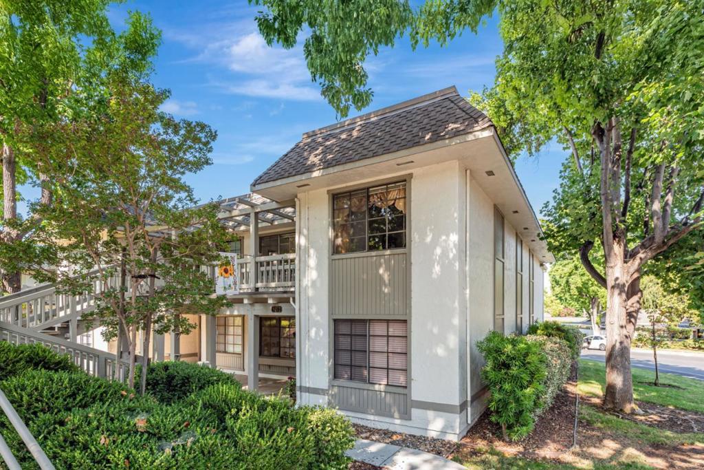 Move right into this stylish upper-level home in The Villages Golf and Country Club, an exclusive 55+ community offering resort-style living. This two-bedroom, two-bath property features double-pane windows, an updated kitchen with tray ceiling lighting, refreshed counters, and a mix of laminate, tile, and carpet flooring. Laundry hook ups, generous storage, and convenient carport parking. This property is just a short walk to the swimming pool, fitness center, and Cribari Center a community hub. The Villages lifestyle includes a clubhouse, bistro, golf course, pickleball, tennis and bocce ball courts, hiking trails, gardens, and a wide range of clubs and social activities: Everything you need to live beautifully every day.