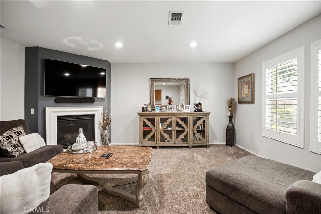 Step into this meticulously maintained 3-bedroom, 2.5-bathroom home that radiates comfort, style, and modern living. With a design that is both elegant and functional, this home offers the perfect blend of luxury and practicality. The spacious kitchen serves as the heart of the home, featuring plenty of counter space and cabinetry—ideal for meal prep and entertaining. The open-concept design seamlessly connects the kitchen to the family room, where a cozy fireplace provides the perfect ambiance for relaxation. Whether you’re hosting guests or enjoying a quiet night, this space will always feel inviting.
The primary suite is a true retreat, complete with a large walk-in closet and an en-suite bathroom featuring dual sinks, a separate bathtub, and a shower. It’s your own personal oasis to unwind after a long day. Additional highlights include plantation shutters throughout, adding both style and privacy to every room. The separate laundry room provides added convenience, while the attached 2-car garage offers ample storage and direct access to the home. Enjoy the benefit of no common walls and a zero lot line, ensuring privacy and a sense of independence. The backyard is tastefully designed with a patio area, perfect for outdoor dining, relaxation, and enjoying the beautiful Southern California weather. Ideally located just minutes from Ontario Mills and Toyota Arena, you'll have easy access to shopping, dining, and entertainment, while still enjoying the peace and quiet of your own home.
This move-in-ready gem offers everything you need and more. Don’t miss the chance to own this gem.