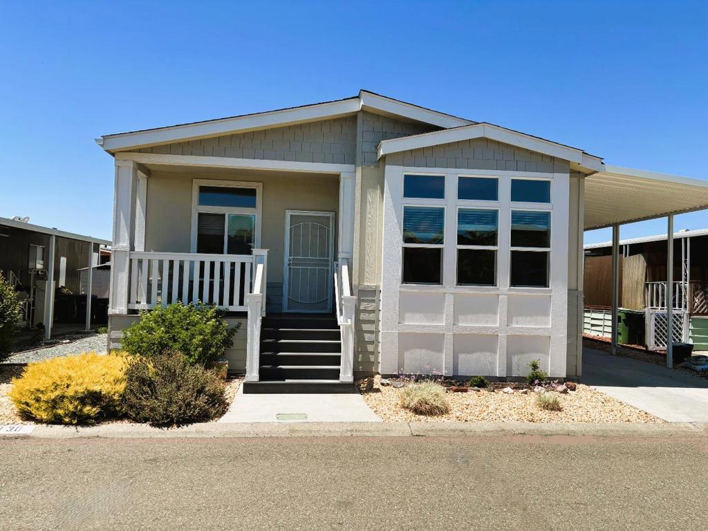 Stunning near new home built in 2019 in a great 55+ Senior Community. Low Space Rent of only $772/mo! Huge kitchen with granite counters and island over upgraded cabinetry. Near new stainless appliances and eat-in-kitchen nook. Many upgrades in a spacious floorplan w three bedrooms and two full bathrooms. The Primary Bedroom has 2 walk in closets. Located in the highly desirable, Spanish Ranch 2. The community offers several amenities including a swimming pool/spa, billiard tables, library, lounge, clubhouse, laundry room, car wash and RV storage.